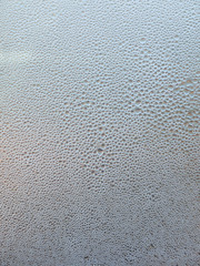 Many water drops on glass background