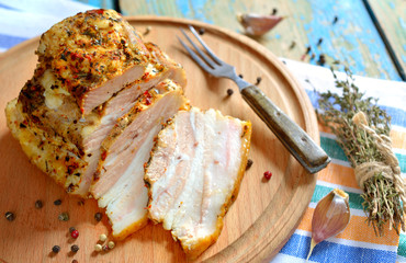 Baked pork on round board.
