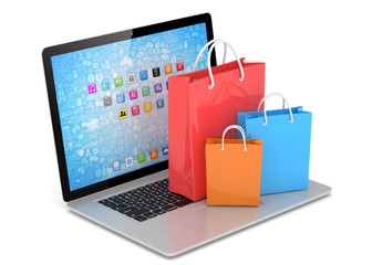 laptop and  shopping pags on white background