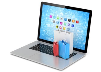 laptop and  shopping pags on white background