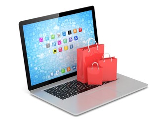 laptop and  shopping pags on white background