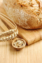 Freshly baked traditional bread on wooden board
