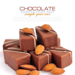 Chocolate praline with almonds on white background