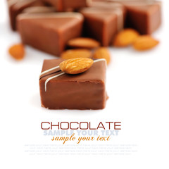 Chocolate praline with almonds on white background