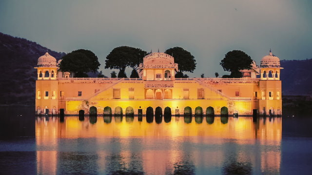 Rajasthan landmark - Jal Mahal (Water Palace) on Man Sagar Lake in the evening in twilight. Jaipur, Rajasthan, India. Vintage retro effect filtered hipster style color graded video.