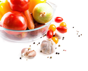 Vegetables in a glass pot isolated on white background