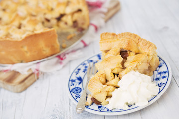 Homemade apple pie on a rustic table