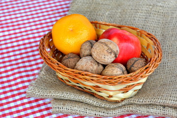 Fruits and walnuts in basket