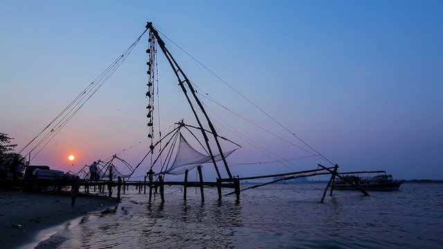 Chinese fishnets on sunset. Landmark and tourist attraction in Fort Kochin, Kochi, Kerala, India