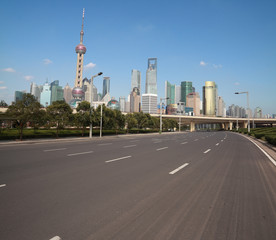 Empty road with Shanghai Lujiazui city buildings