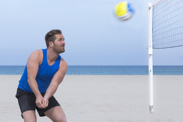 man playing beach volley.