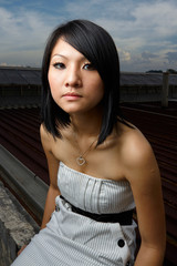 A shot of a beautiful asian woman outdoor