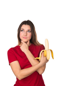 The girl with a banana isolated on a white