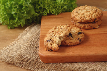 Oat raisin cookies on chopping board