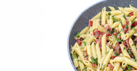 Italian Food: Pasta called mezze pennette with tomatos in pieces and arugula
