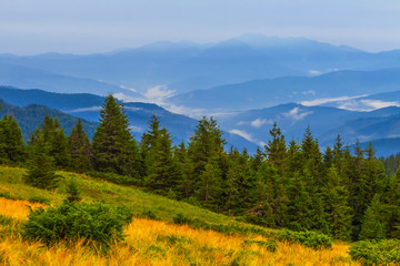 Fototapeta na wymiar beautiful blue misty mountain scene