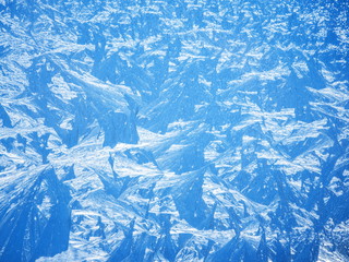 Ice crystals on the surface of the window.
