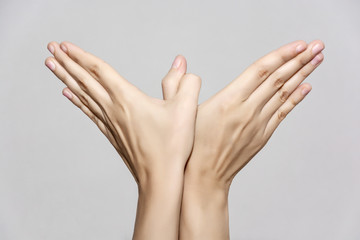 Woman's hands makes bird shape