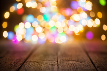 Festive background -  Colorful lights on wood