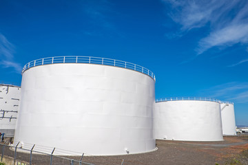 White gas storage tanks in the harbor of Reykjavik, Iceland