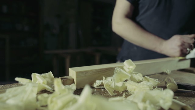 joiner whittle workpiece of wood with jack-plane slow motion