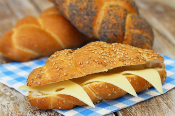 Sesame seed challah sandwich with cheese
