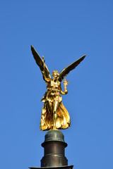 Fototapeta na wymiar MUNICH, GERMANY - Gilded statue featuring a Peace Angel (Friedensengel) on the top of a column