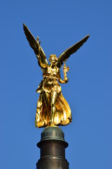 Fototapeta na wymiar MUNICH, GERMANY - Gilded statue featuring a Peace Angel (Friedensengel) on the top of a column