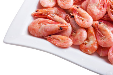 Shrimps on a square dish, isolated on white