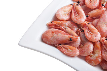 Shrimps on a square dish, isolated on white
