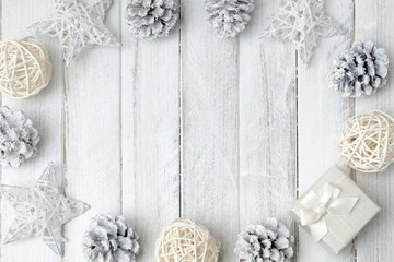White Christmas border with gift box, white wood background