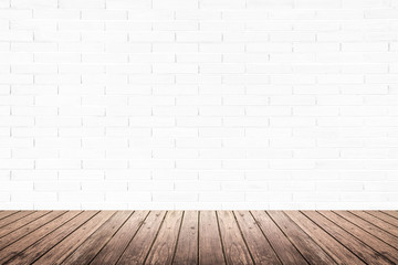 interior room with brick wall and wood floor