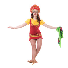Young woman wearing a folk costumes dancing.  Isolated on white in full length with copyspace