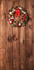 Beautiful Christmas wreath on the wooden background