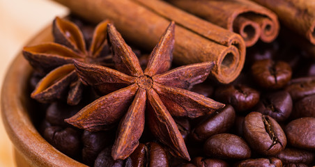 of coffee with coffee beans and cinnamon sticks