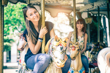 Obraz na płótnie Canvas Women on a merry-go-round