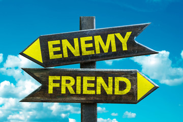 Enemy - Friend signpost with sky background