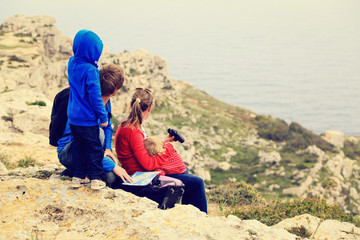 Fototapeta na wymiar family with two kids travel in mountains