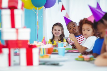 Smiling kids at a birthday party