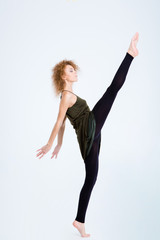 Fototapeta premium Flexible woman posing isolated on a white background