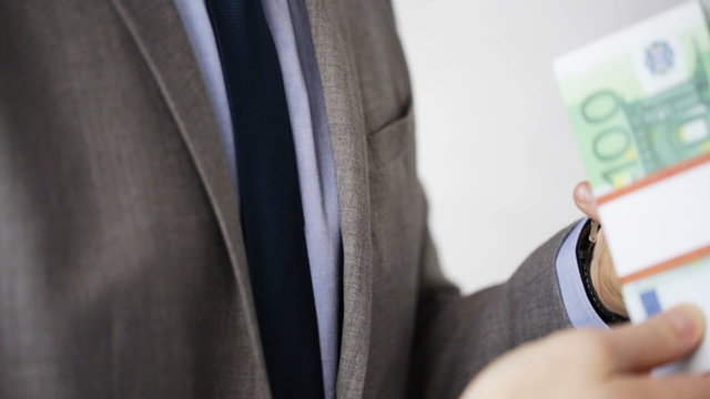 close up of businessman taking money bribe
