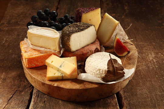 Assorted Cheeses On A Rustic Platter