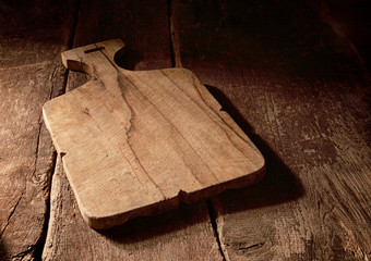 Two rustic wooden cheese boards