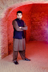 Portrait of young Man in a traditional Pathan dress with modern