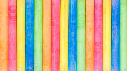 Row of rainbow colored chalk background