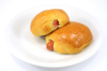 two Bread with Sausage on white plate