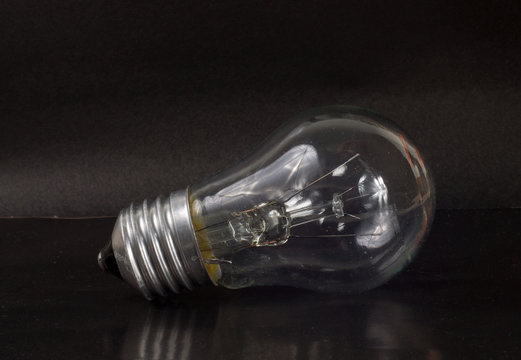 incandescent light bulb black background