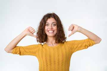 Smiling woman pointing fingers on herself