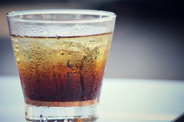 Cola with ice cubes