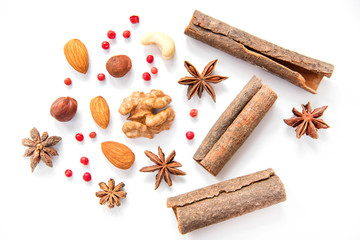 nuts and spices on white background, сinnamom, Illicium, almond, coffee beans, pink peppercorn